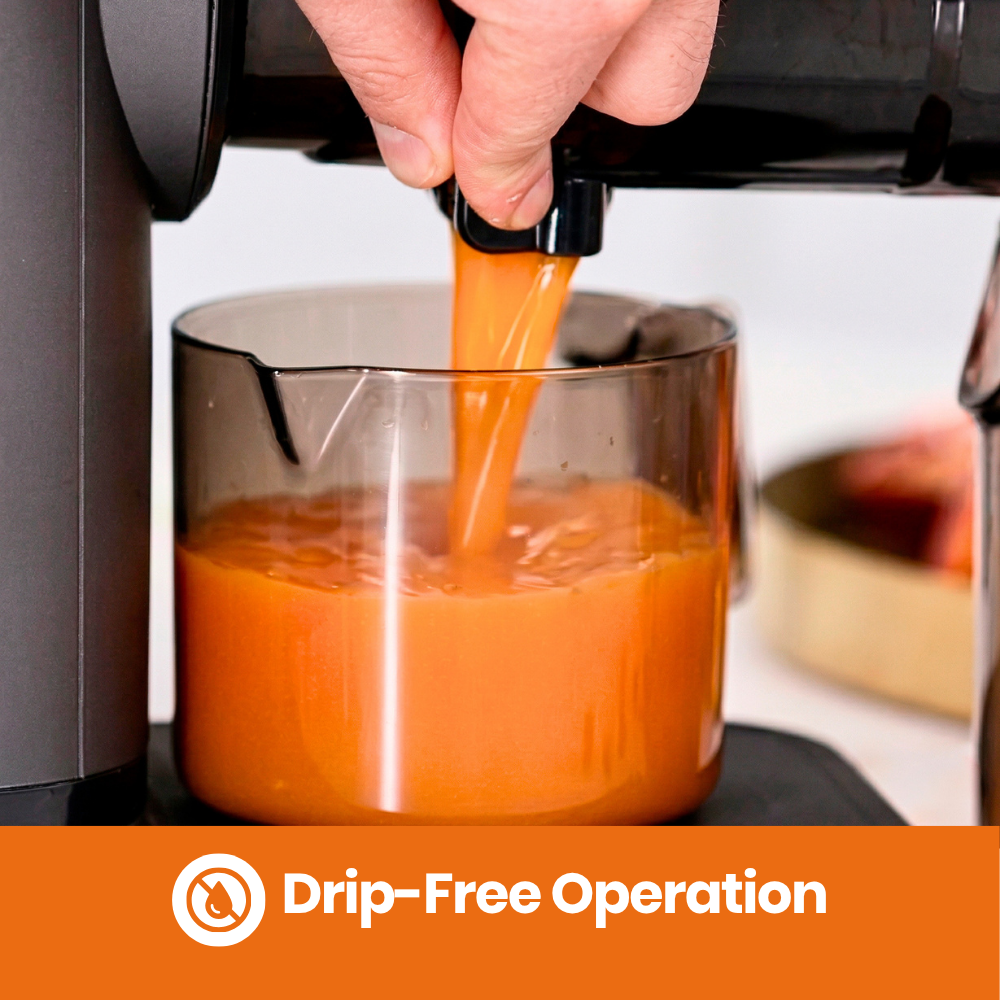 Orange juice being poured from the h3000 essential horizontal juicer into a glass,'Drip-Free Operation'